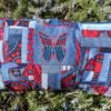 Housse coussin papillon rouge et bleu