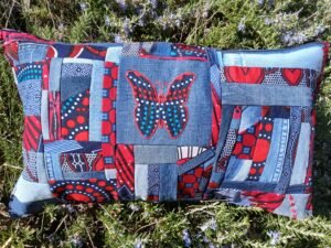 20260402_162222 Housse coussin papillon rouge et bleu